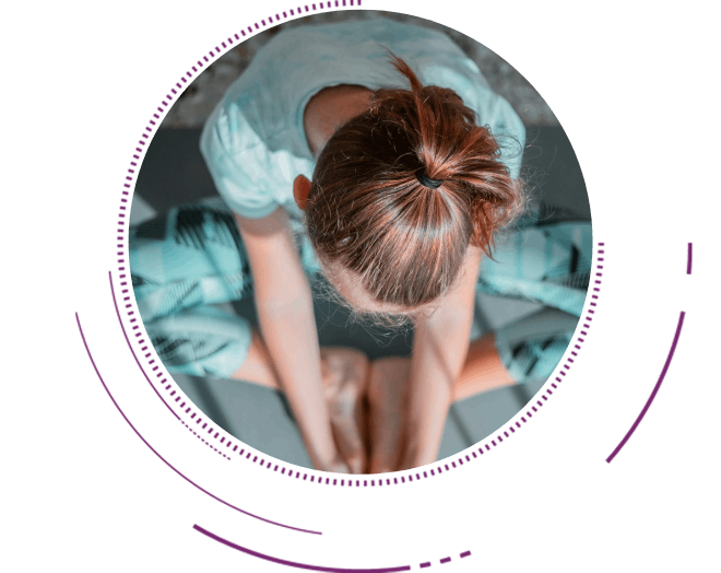 girl in teal t-shirt lying on white and black stripe bed